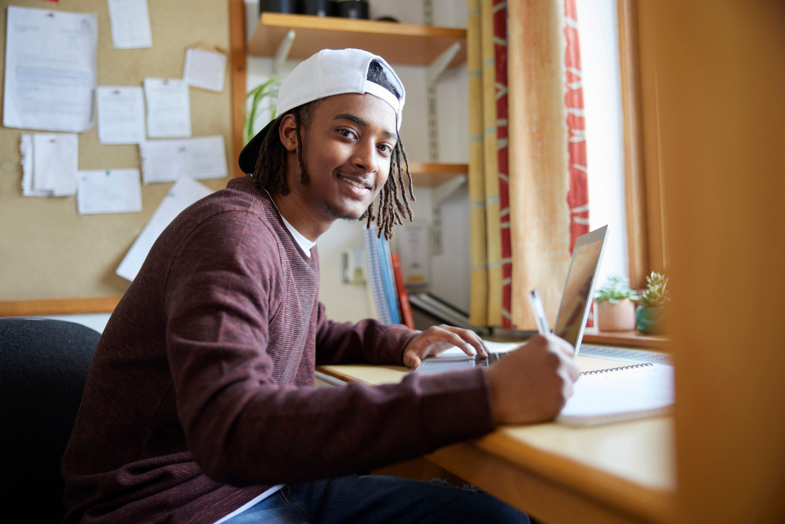 Teenage boy laughing.